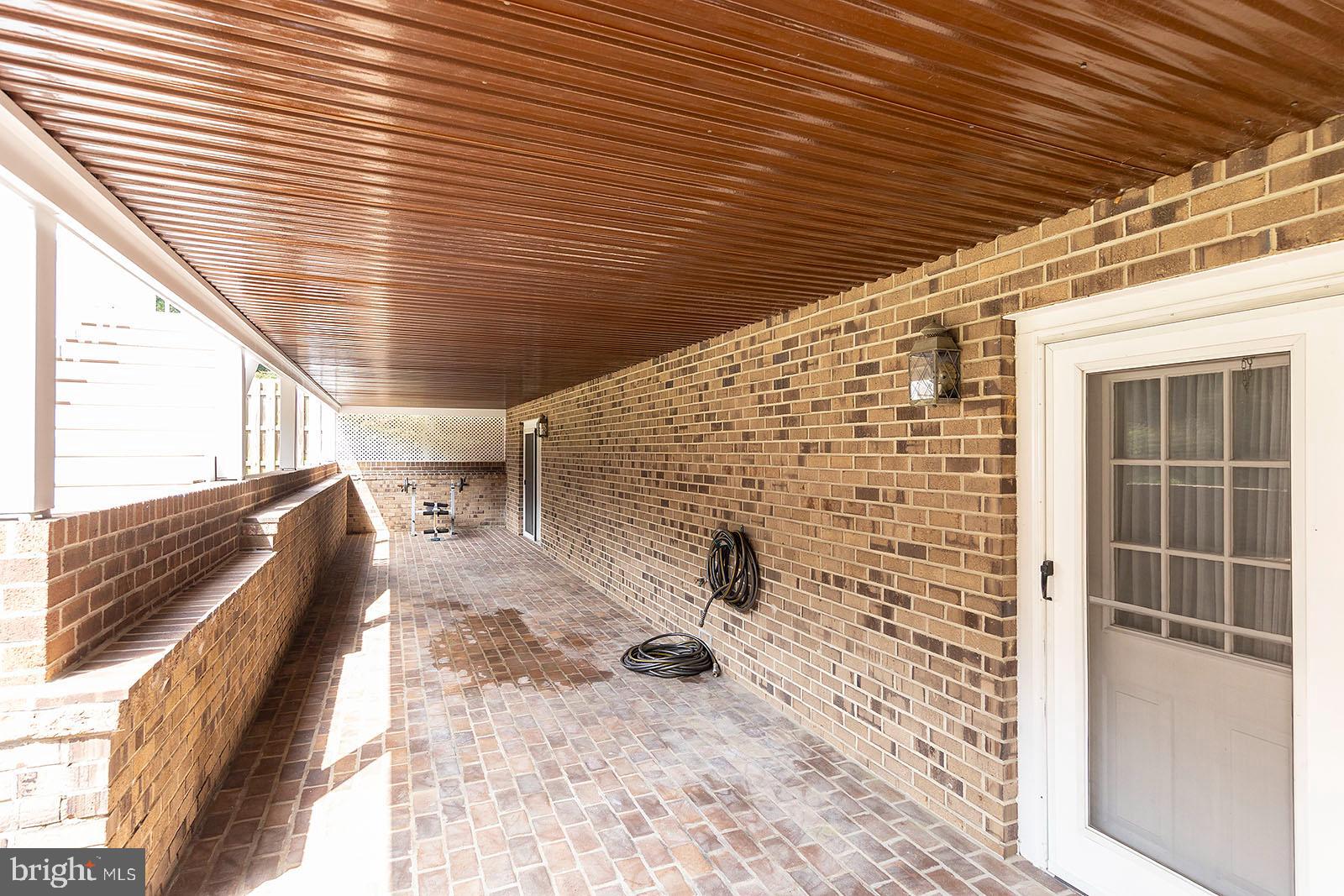 127 Stonebrook Road Winchester, VA 22602 - Photo 54 of 64 Covered brick patio