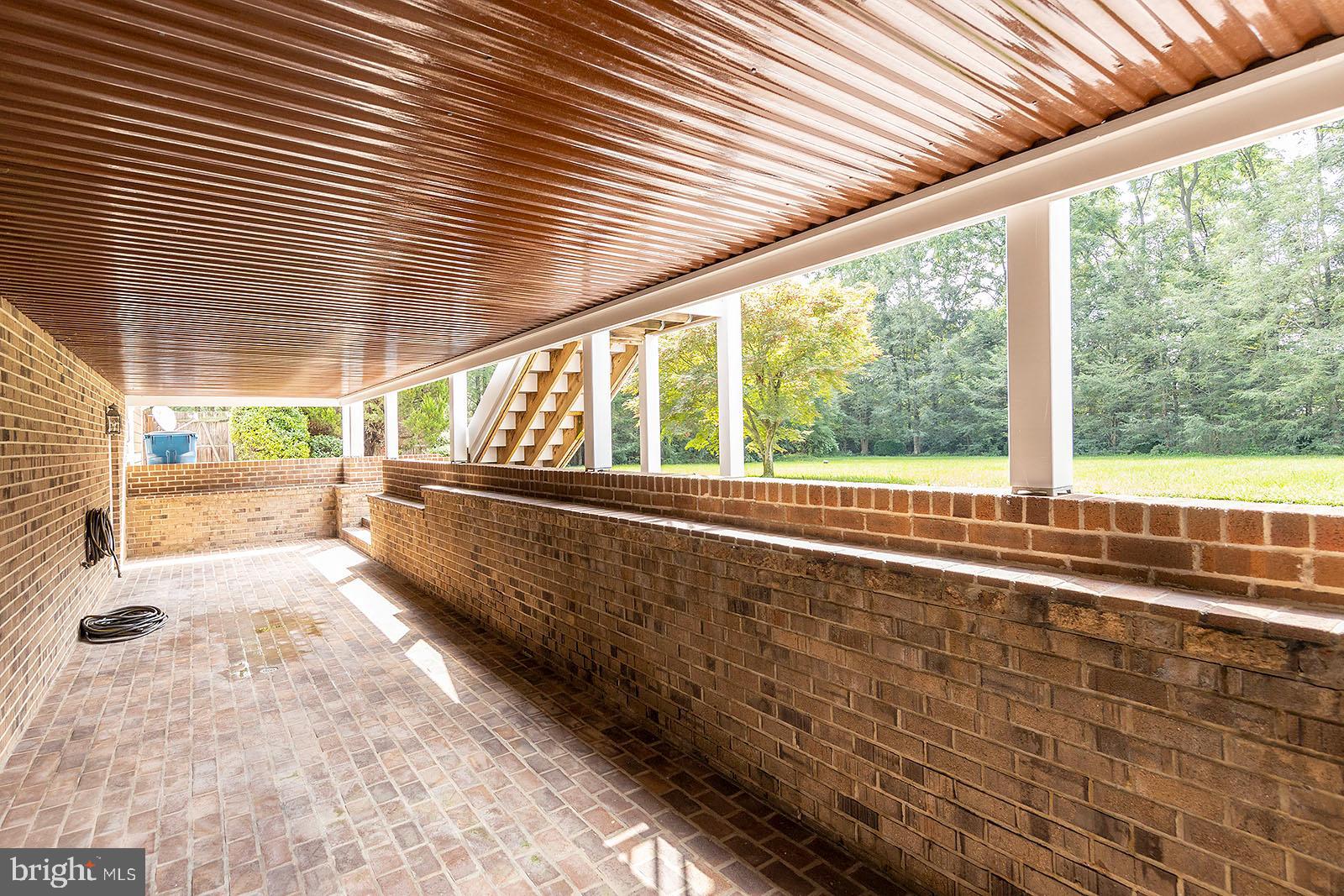 127 Stonebrook Road Winchester, VA 22602 - Photo 55 of 64 Covered brick patio