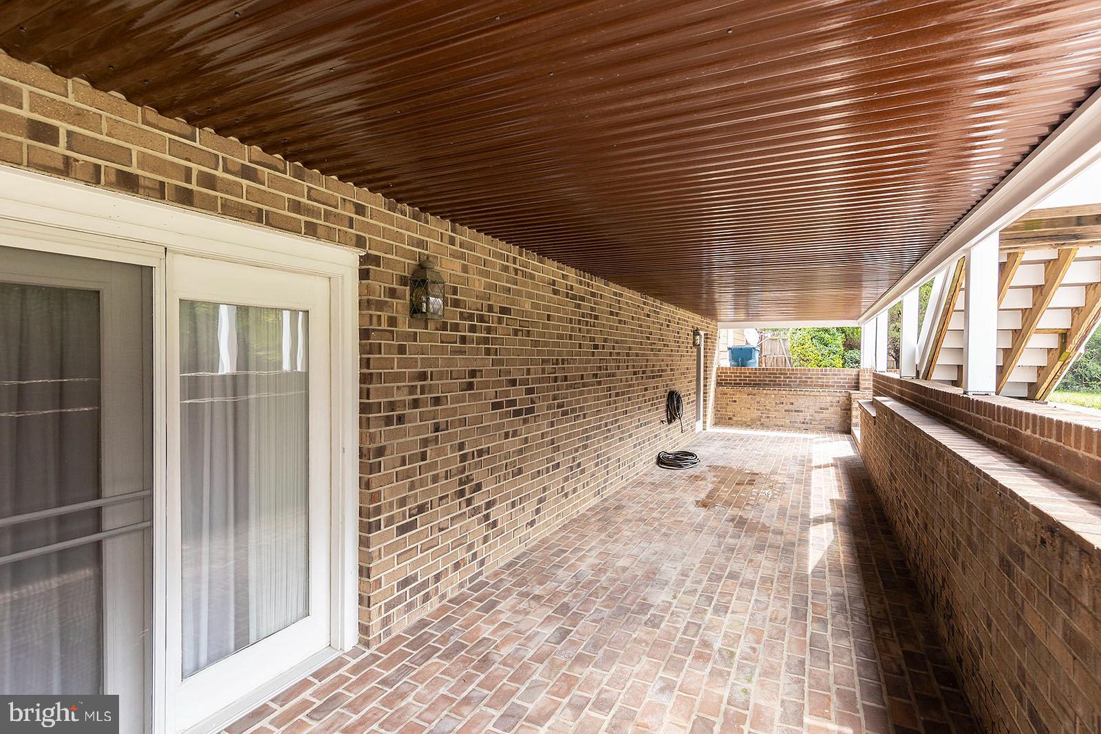 127 Stonebrook Road Winchester, VA 22602 - Photo 56 of 64 Covered brick patio