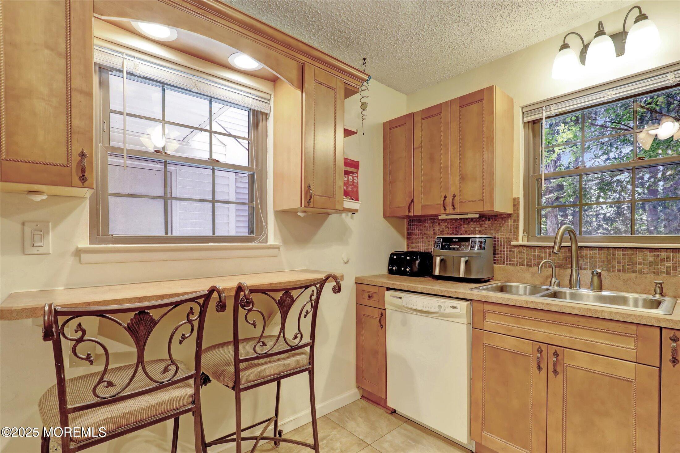 95 Azalea Circle Jackson, NJ 08527 - Photo 12 of 38 a kitchen with a sink cabinets and window