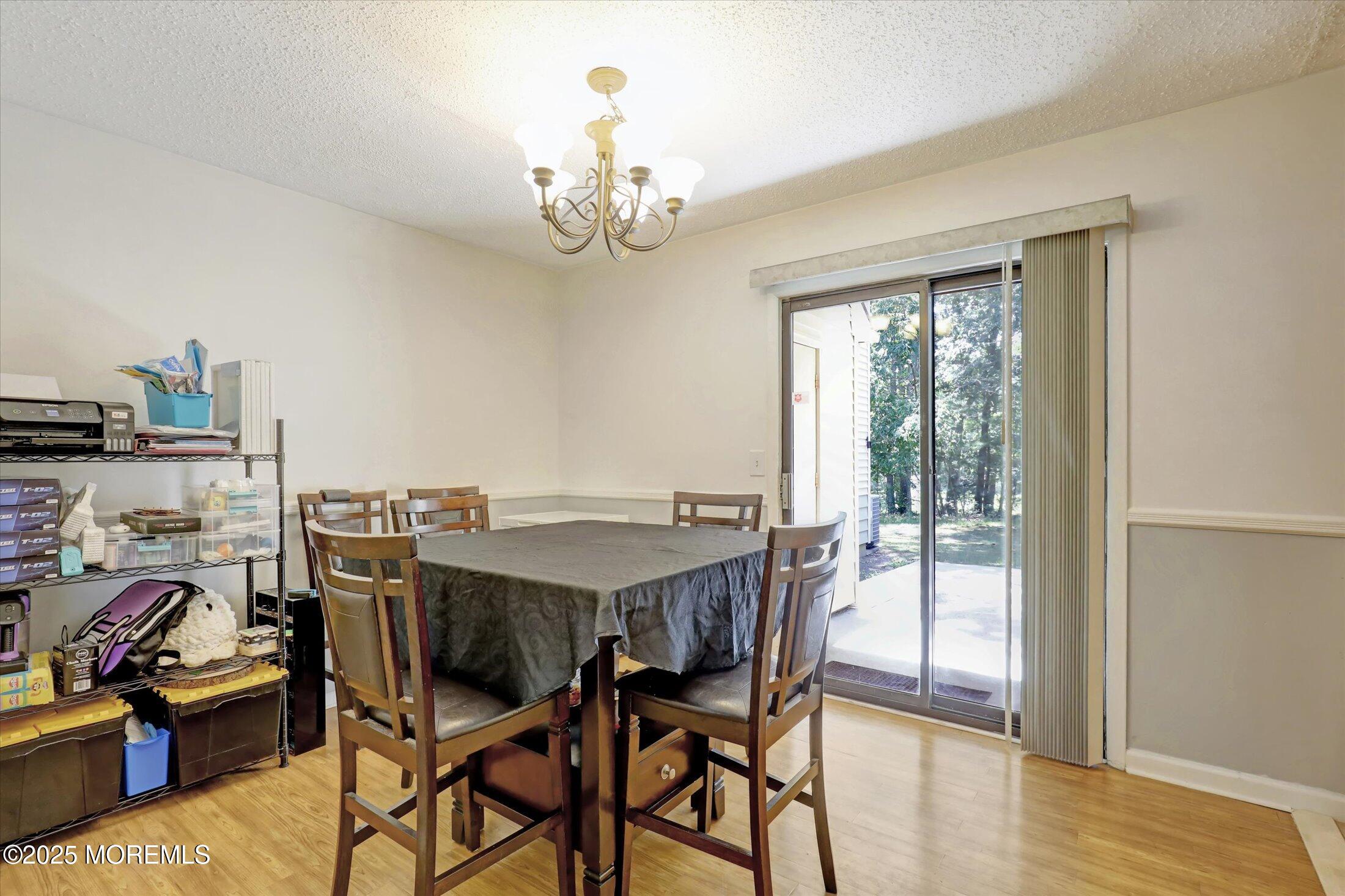 95 Azalea Circle Jackson, NJ 08527 - Photo 17 of 38 a view of a dining room with furniture window and wooden floor
