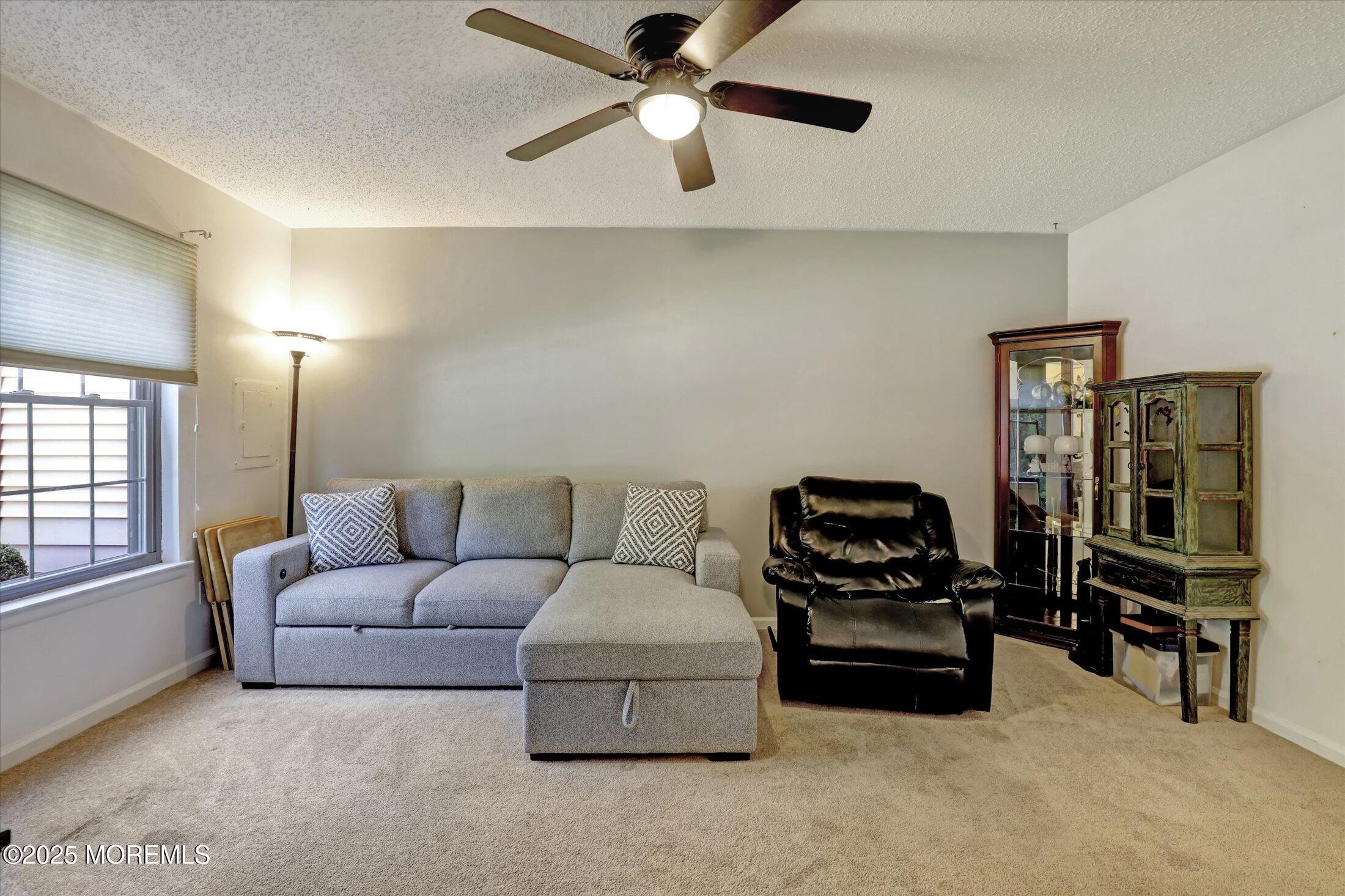 95 Azalea Circle Jackson, NJ 08527 - Photo 18 of 38 a living room with furniture and a flat screen tv