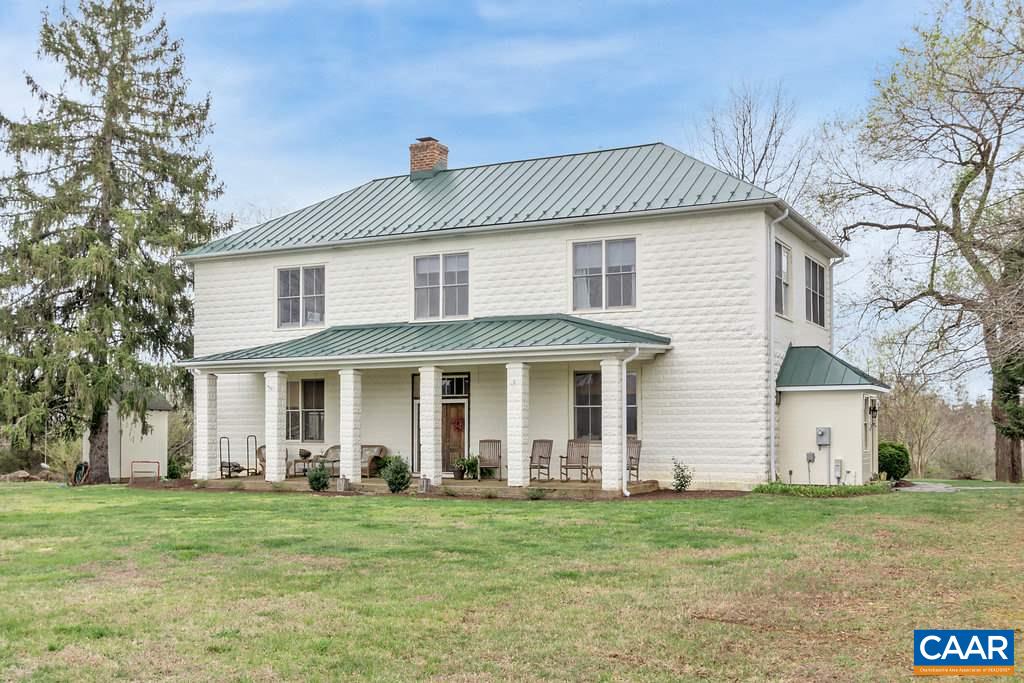 4543 Garth Road Charlottesville, VA 22901 - Photo 1 of 50 a front view of a house with a garden