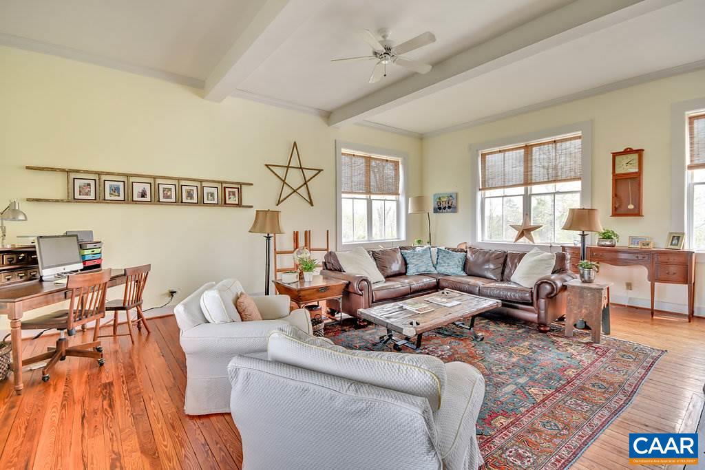4543 Garth Road Charlottesville, VA 22901 - Photo 12 of 50 a living room with furniture and a large window