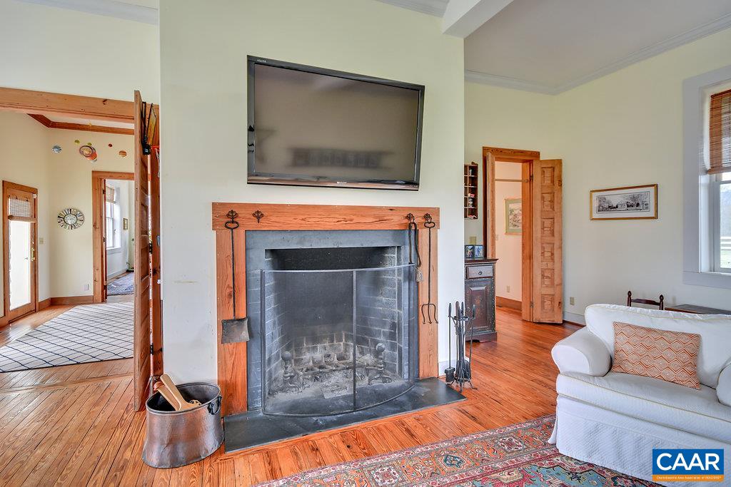 4543 Garth Road Charlottesville, VA 22901 - Photo 14 of 50 a living room with furniture and a flat screen tv