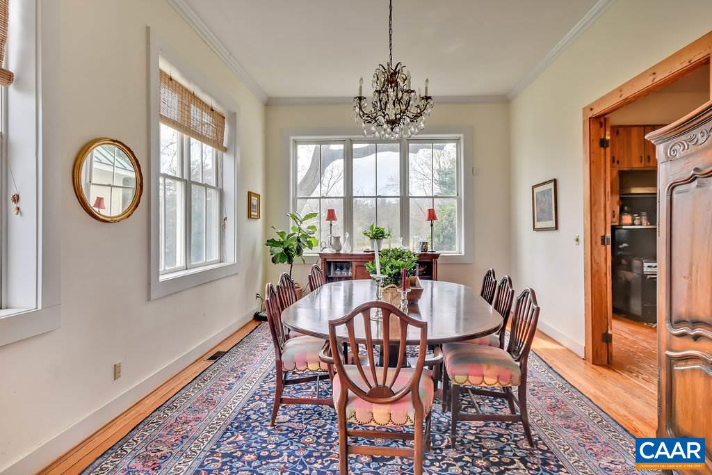 4543 Garth Road Charlottesville, VA 22901 - Photo 21 of 50 a view of a dining room with furniture window and wooden floor