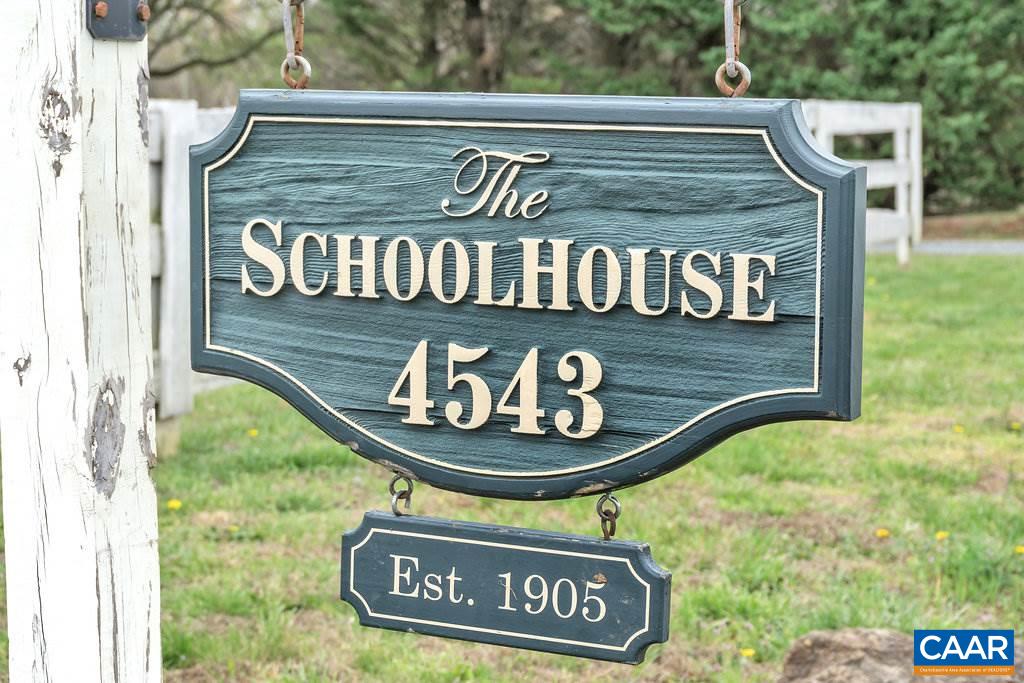 4543 Garth Road Charlottesville, VA 22901 - Photo 3 of 50 a sign broad on a brick wall