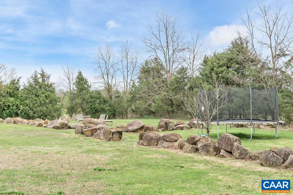 4543 Garth Road Charlottesville, VA 22901 - Photo 42 of 50 a view of a lake with a yard