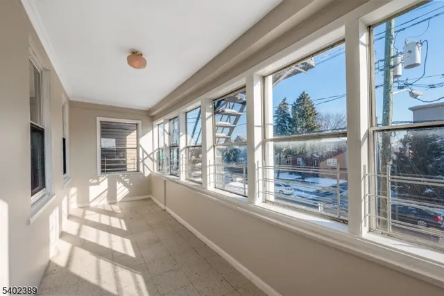 a view of a room with a large window