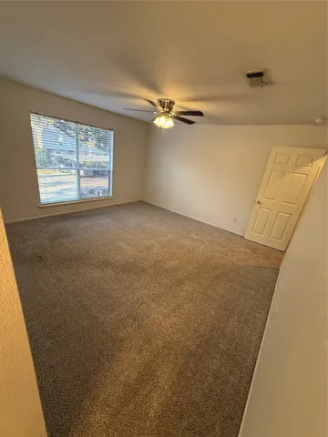 a view of empty room with windows