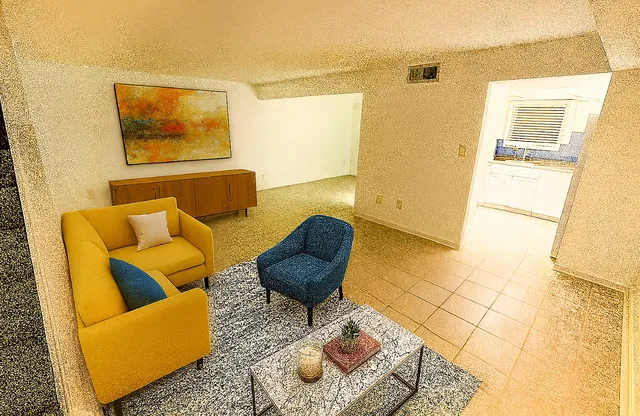 a living room with furniture and a rug