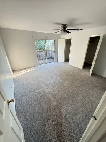 a view of a livingroom with wooden floor and window