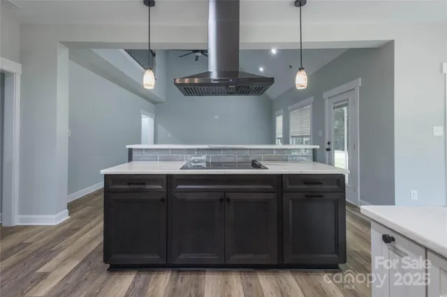 a kitchen with a sink and chandelier