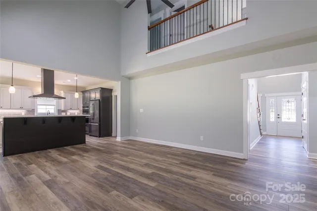a kitchen with granite countertop a sink and a stove top oven