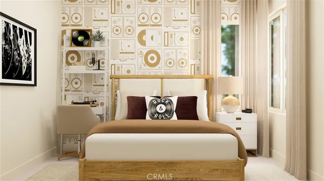 a bedroom with a bed and painting on the wall