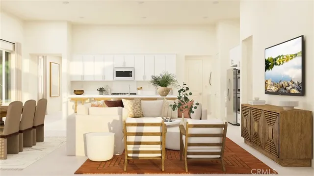 a living room with furniture a flat screen tv and a refrigerator