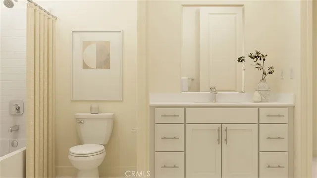 a bathroom with a sink a toilet and shower curtain