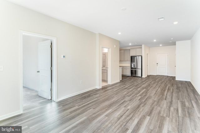 a view of a livingroom with wooden floor