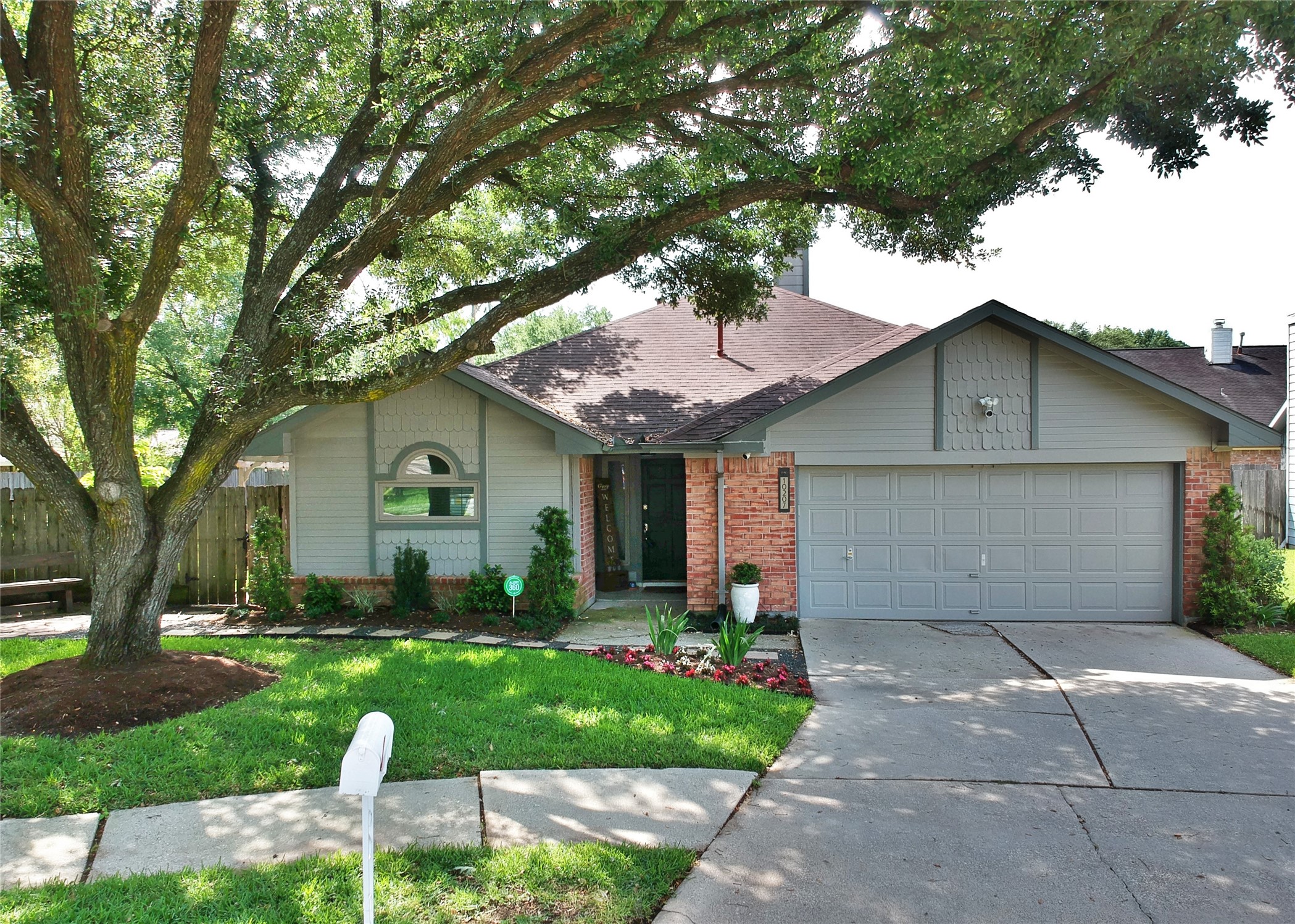 10207 Wayward Wind Lane Houston, TX 77064 - Photo 1 of 35 a front view of house with yard and green space