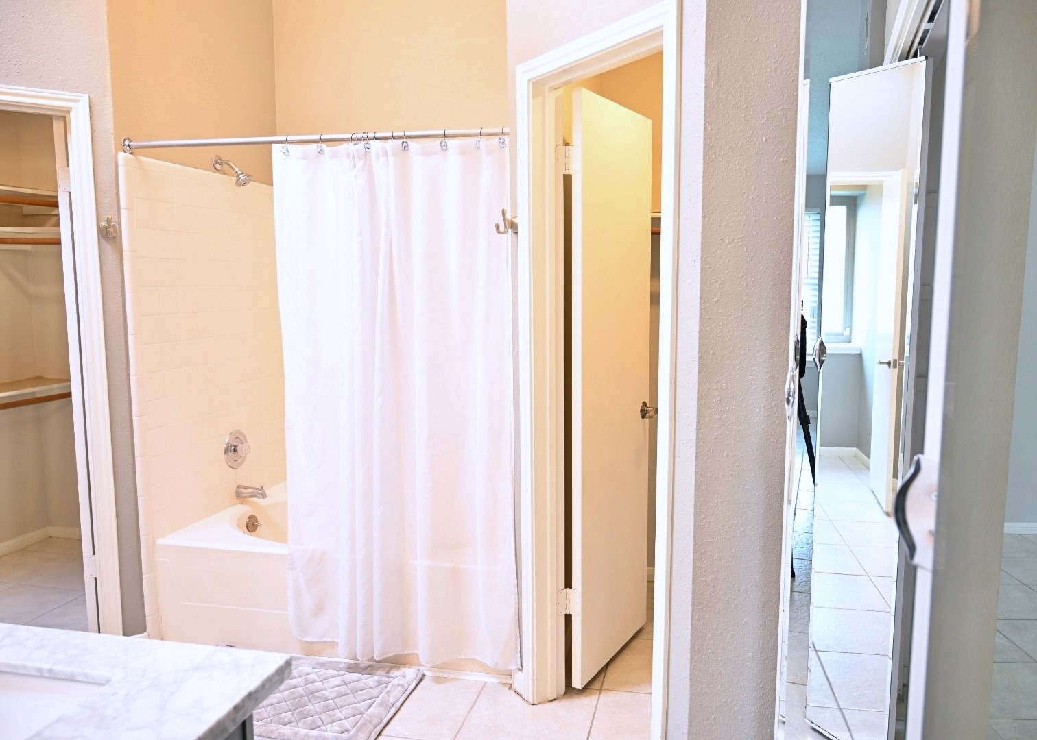 10207 Wayward Wind Lane Houston, TX 77064 - Photo 21 of 35 a bathroom with a shower and a tub