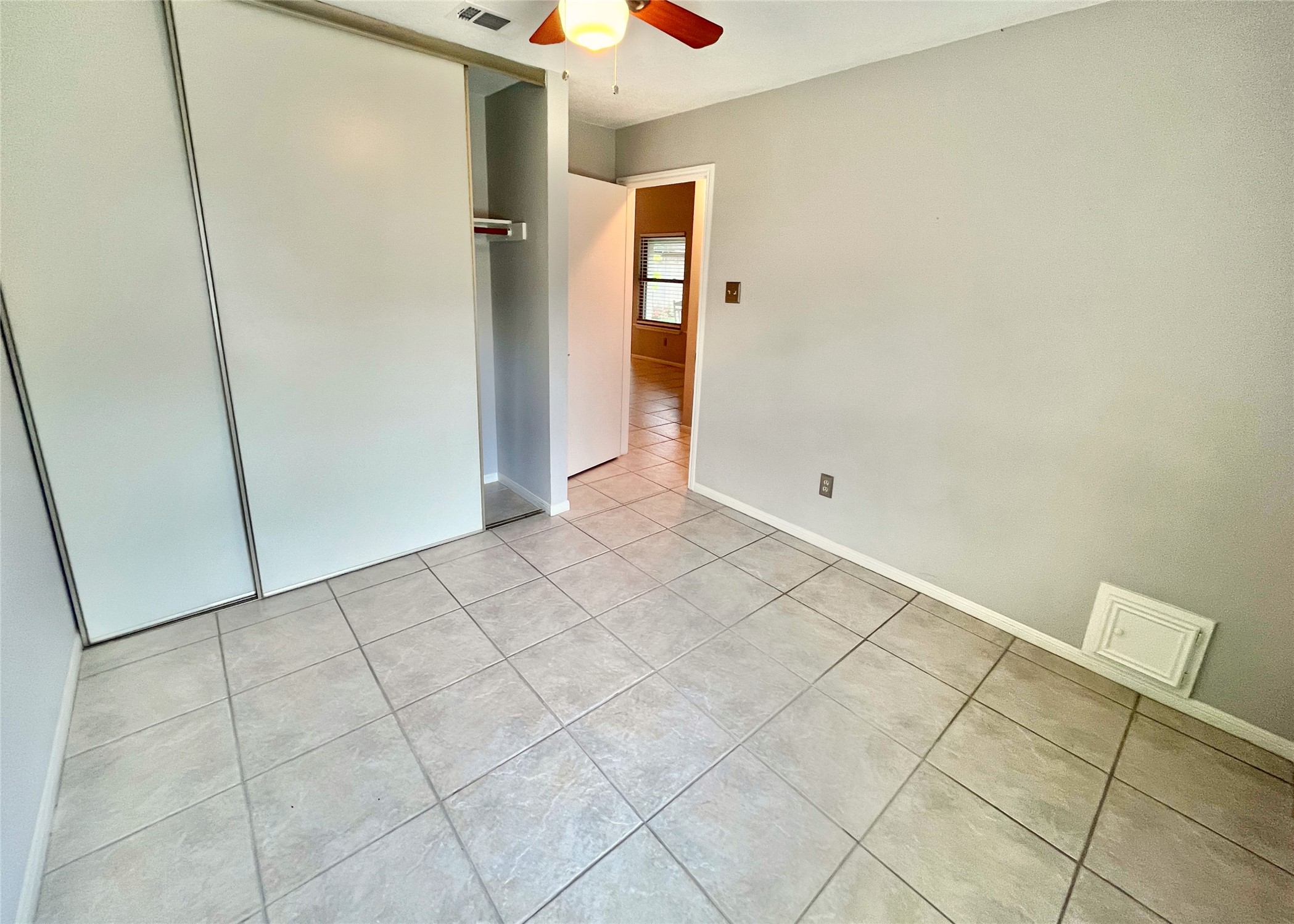10207 Wayward Wind Lane Houston, TX 77064 - Photo 25 of 35 an empty room with wooden floor and cabinet