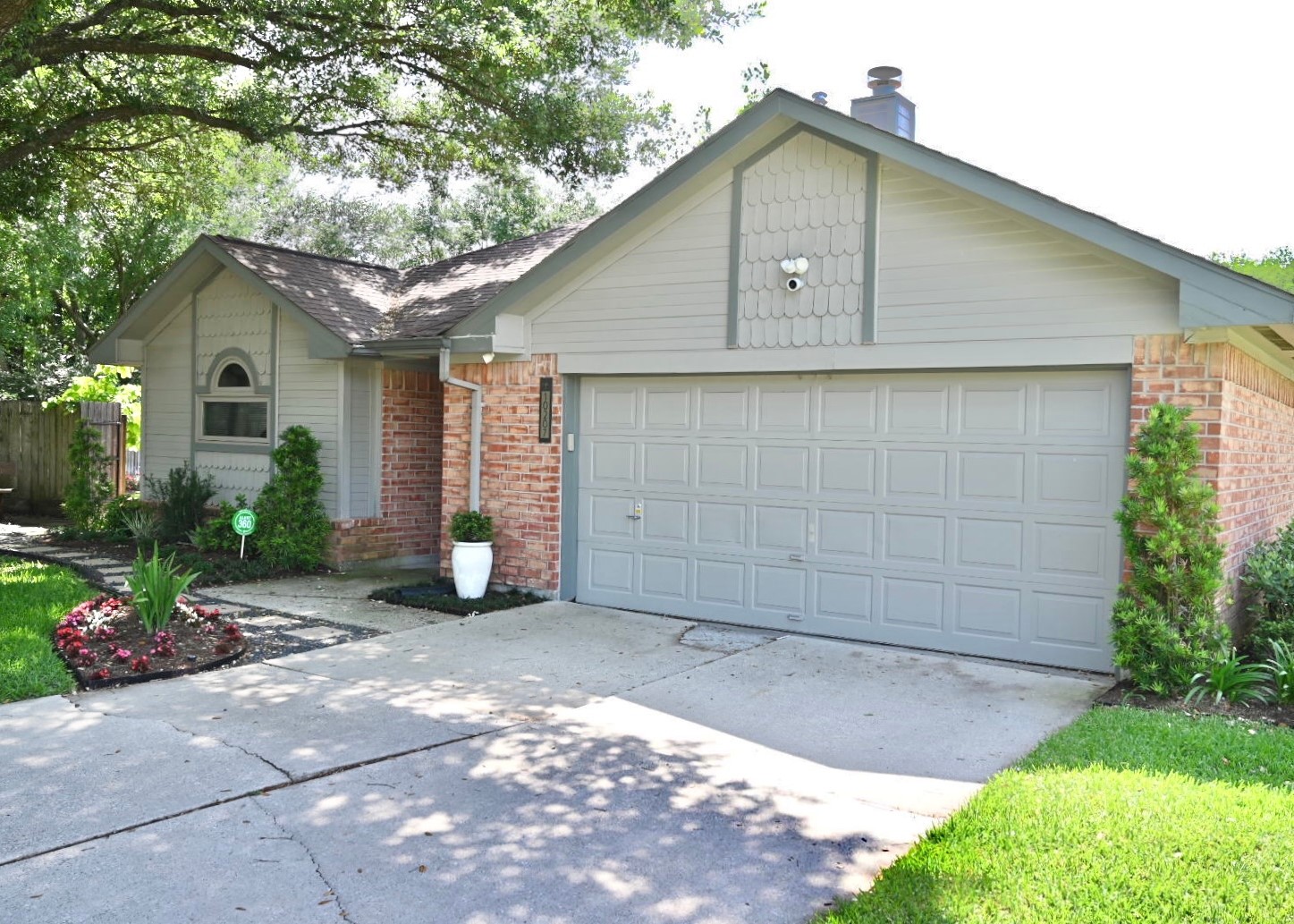 10207 Wayward Wind Lane Houston, TX 77064 - Photo 3 of 35 a front view of a house with a yard and garage