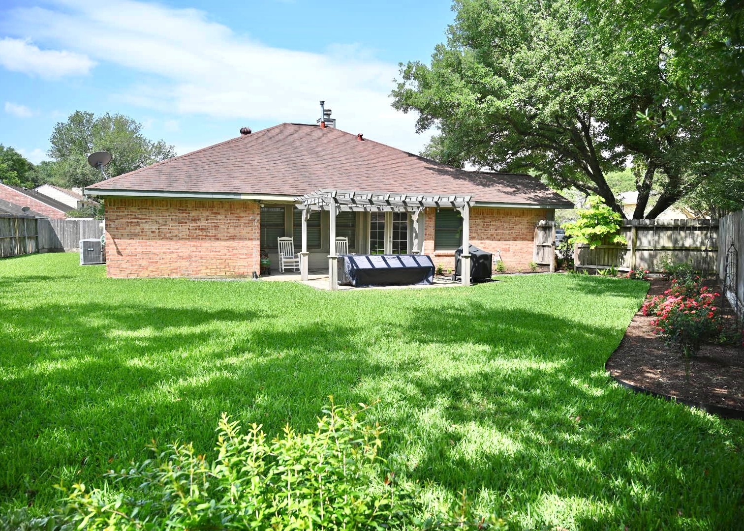 10207 Wayward Wind Lane Houston, TX 77064 - Photo 32 of 35 a front view of a house with a yard and potted plants
