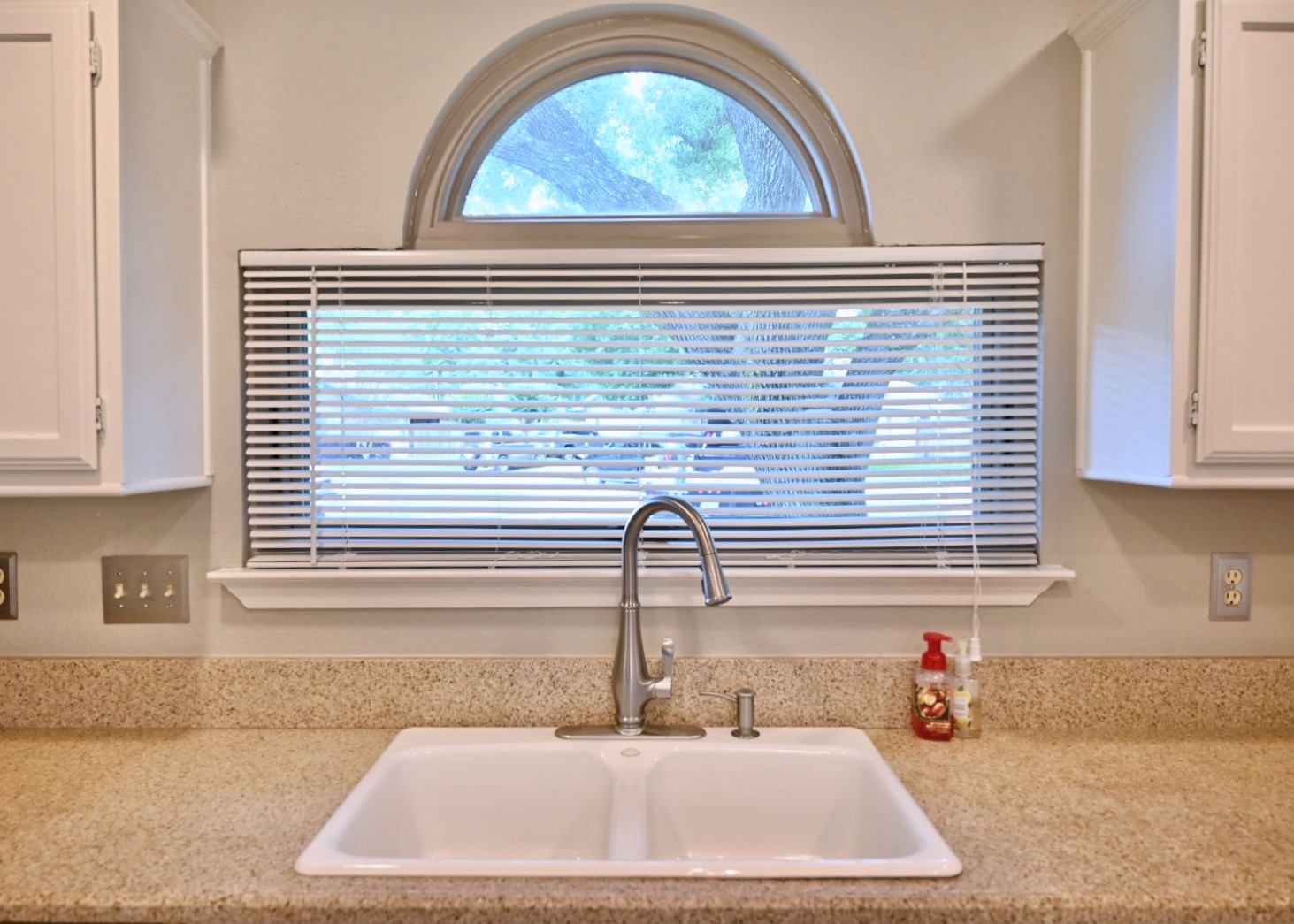 10207 Wayward Wind Lane Houston, TX 77064 - Photo 5 of 35 a kitchen with a sink cabinets and a window
