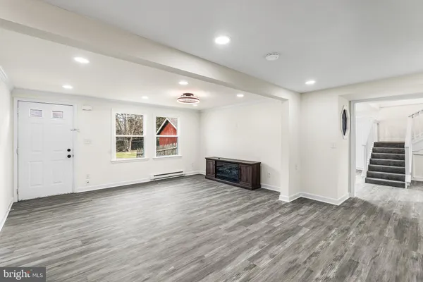 a kitchen with stainless steel appliances granite countertop a stove a refrigerator and a microwave