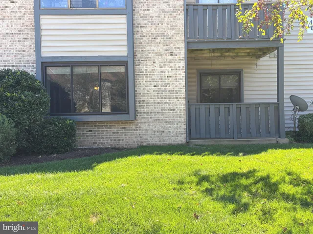 a view of front door of house with yard