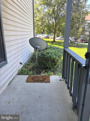a view of hallway with wooden floor