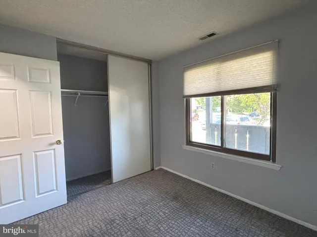 a bathroom with a toilet and a bathtub