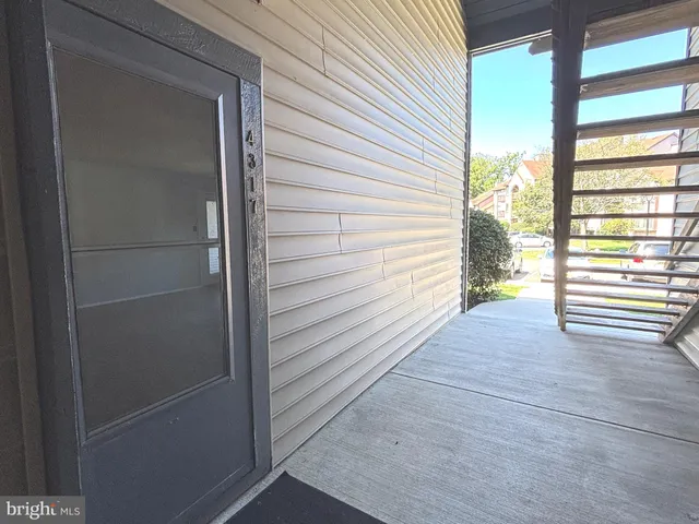 a view of front door and deck of the house