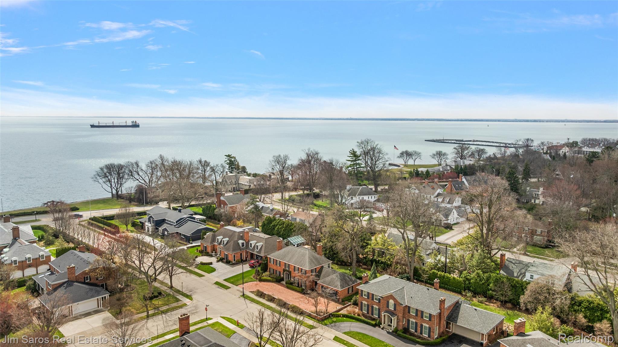 Aerial perspective of suburban area with a nearby body of water