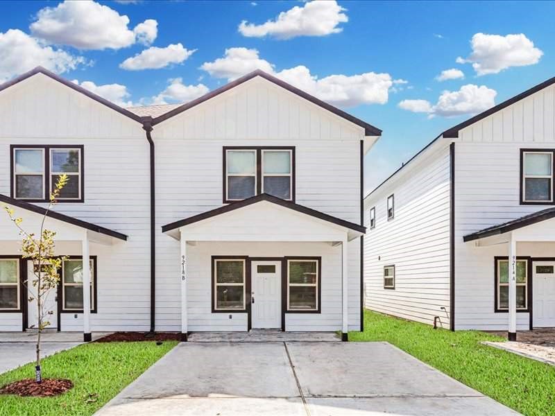 7838 Booker Street, Unit B Houston, TX 77028 - Photo 1 of 28 a front view of a house with a yard