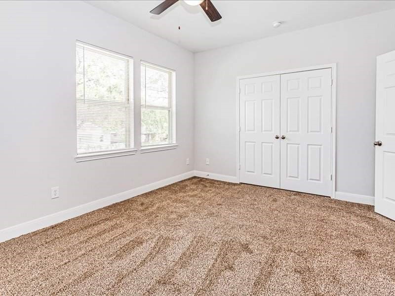 7838 Booker Street, Unit B Houston, TX 77028 - Photo 15 of 28 an empty room with cabinet and windows