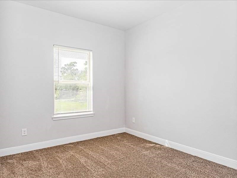 7838 Booker Street, Unit B Houston, TX 77028 - Photo 23 of 28 an empty room with a window