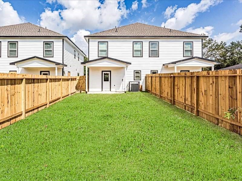 7838 Booker Street, Unit B Houston, TX 77028 - Photo 25 of 28 a front view of a house with a yard