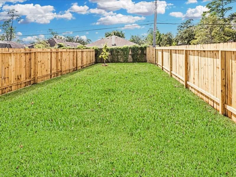 7838 Booker Street, Unit B Houston, TX 77028 - Photo 26 of 28 a view of a backyard with wooden fence