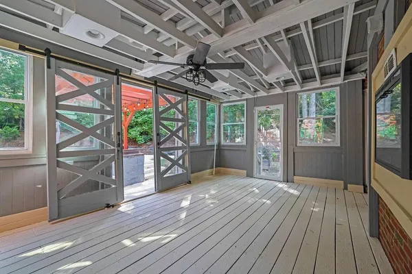 a view of porch with wooden floor
