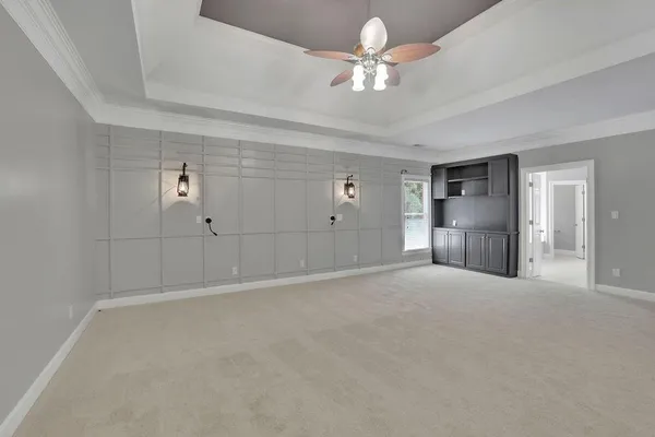 a kitchen with stainless steel appliances granite countertop a sink a stove a microwave and wooden cabinets