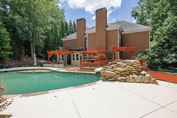 a view of building and yard with trees