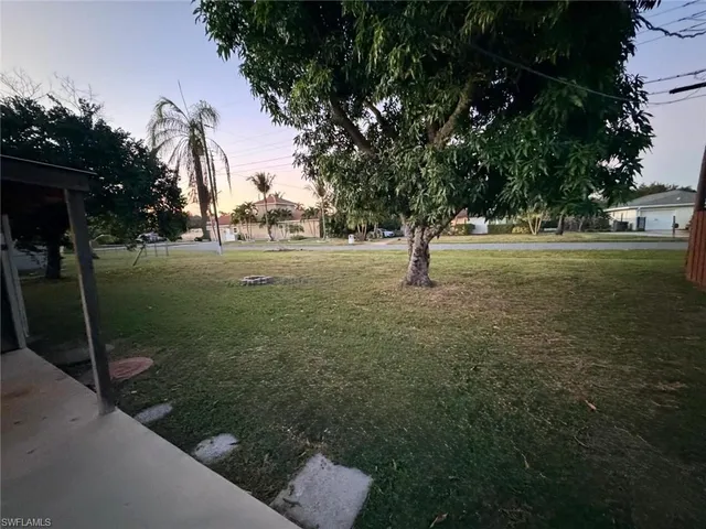 a backyard of a house with lots of green space