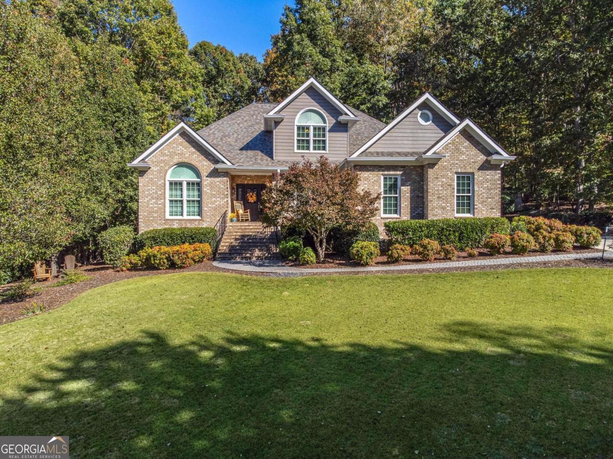 a front view of a house with garden