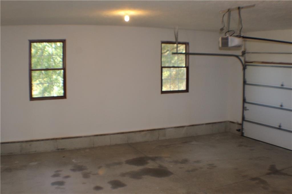 32 Intermediate Drive Coal Center, PA 15423 - Photo 13 of 36 2 car attached garage has concrete floor, auto door and 2 transmitters.