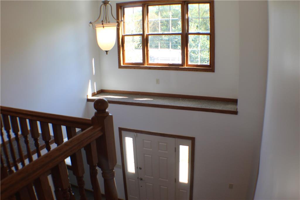 32 Intermediate Drive Coal Center, PA 15423 - Photo 23 of 36 An oversized, swirled glass chandelier and a huge window brighten up this open area.