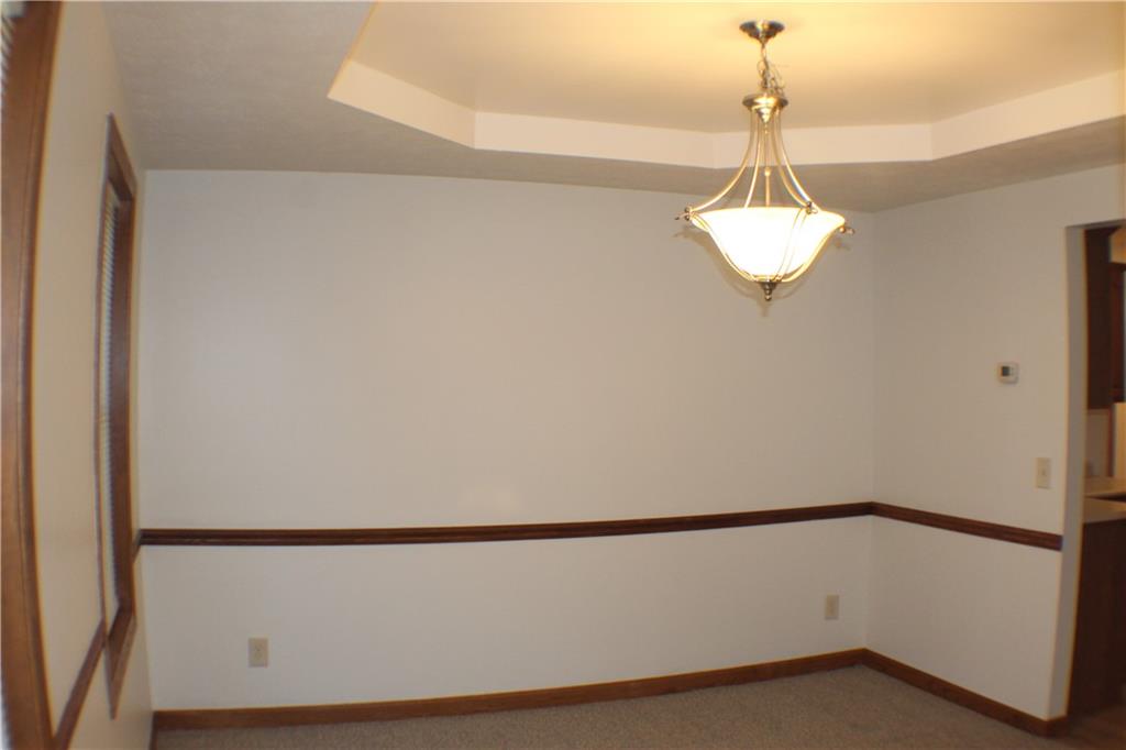 32 Intermediate Drive Coal Center, PA 15423 - Photo 6 of 36 To the left is a formal dining room with chair rail trim.