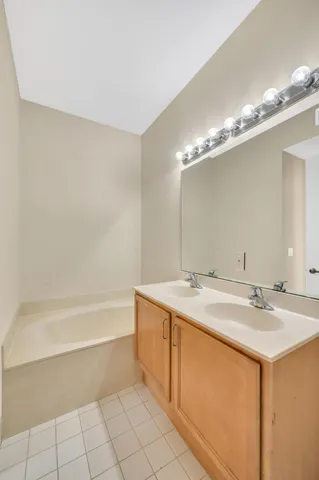 a bathroom with a sink a vanity and a mirror