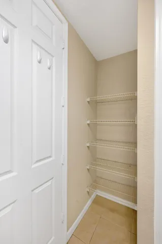 a view of an empty walk in closet
