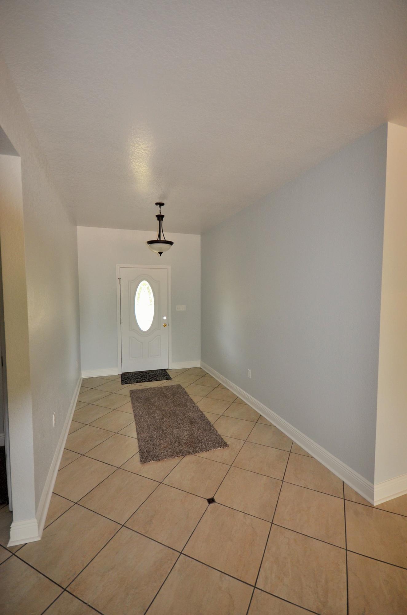 3944 Painter Branch Road Crestview, FL 32539 - Photo 3 of 21 a view of an empty room with a window